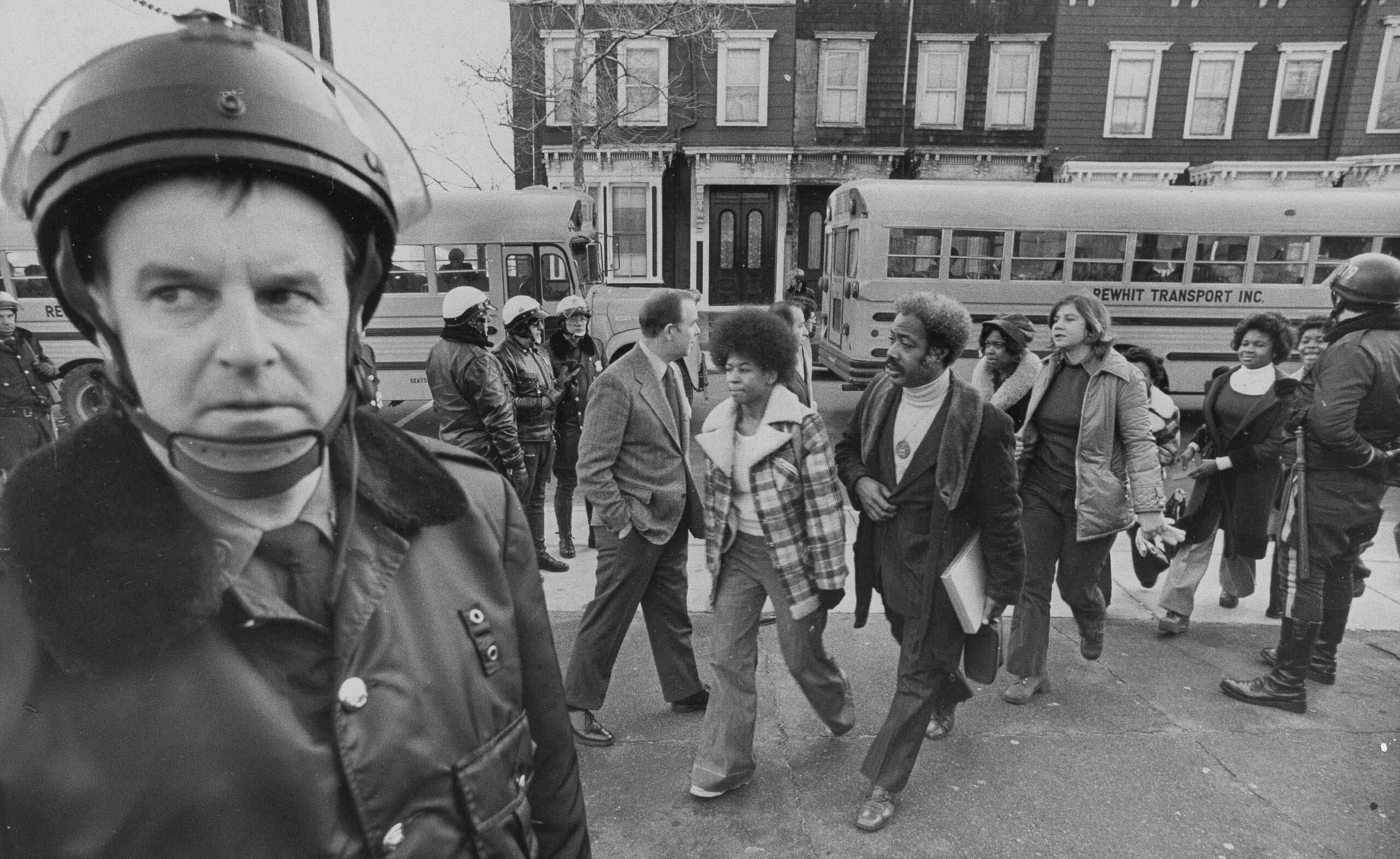 Buses arrive at South Boston High School, Jan. 8, 1975. (AP Photo)